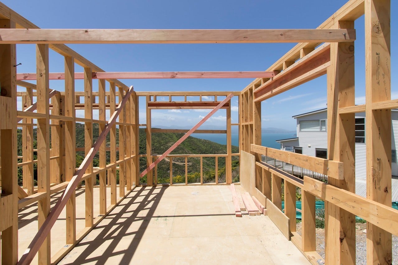 Construction image showing timber framing and Wellington landscape, highlighting Smartway's craftsmanship and smooth renovation process.